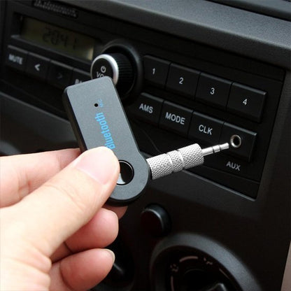 Adaptateur bluetooth voiture main qui le branche dans port AUX